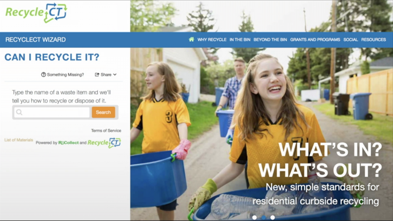 Image of two girls carrying recycling bins with words saying "What's IN, What's OUT."